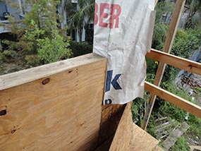 A common problem with the manner in which a water-resistant barrier is installed.